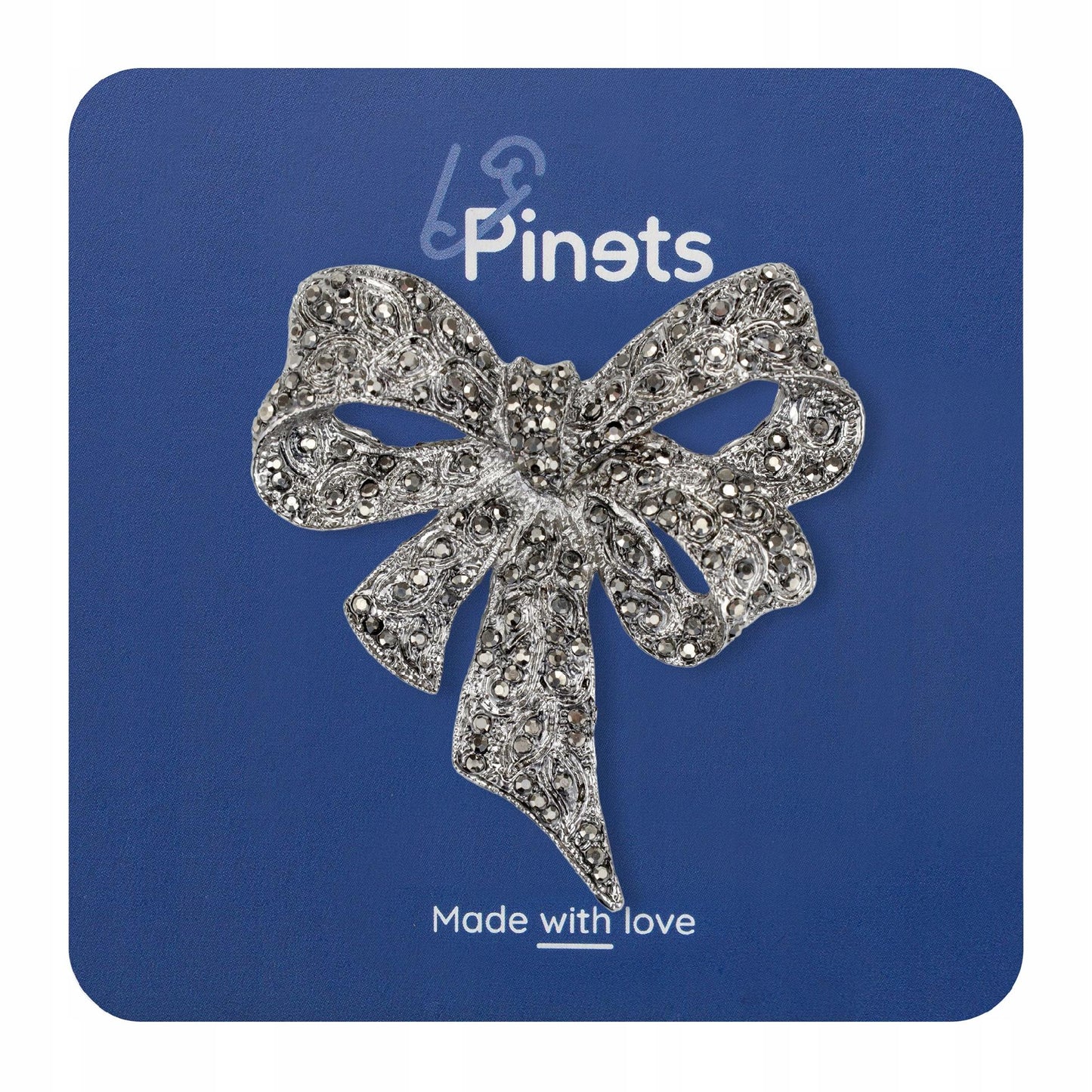 Srebrna kokarda z cyrkoniami - broszka