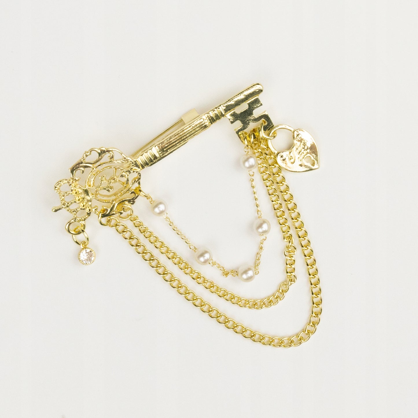 Klucz z kłódką w kształcie serca - złota broszka z łańcuszkami