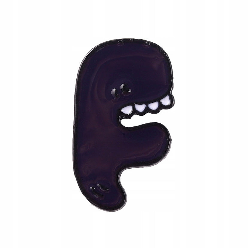 Litera F z zębami - fioletowa przypinka